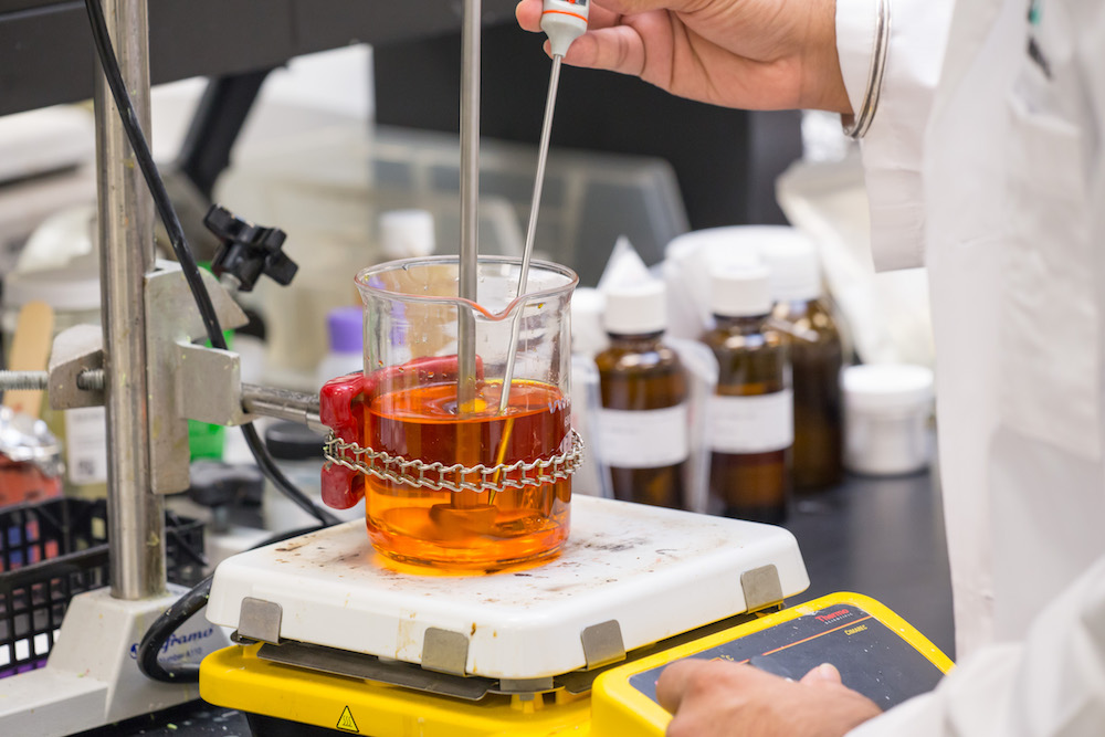 Chemist formulating a wellness product in the Radiantz laboratory