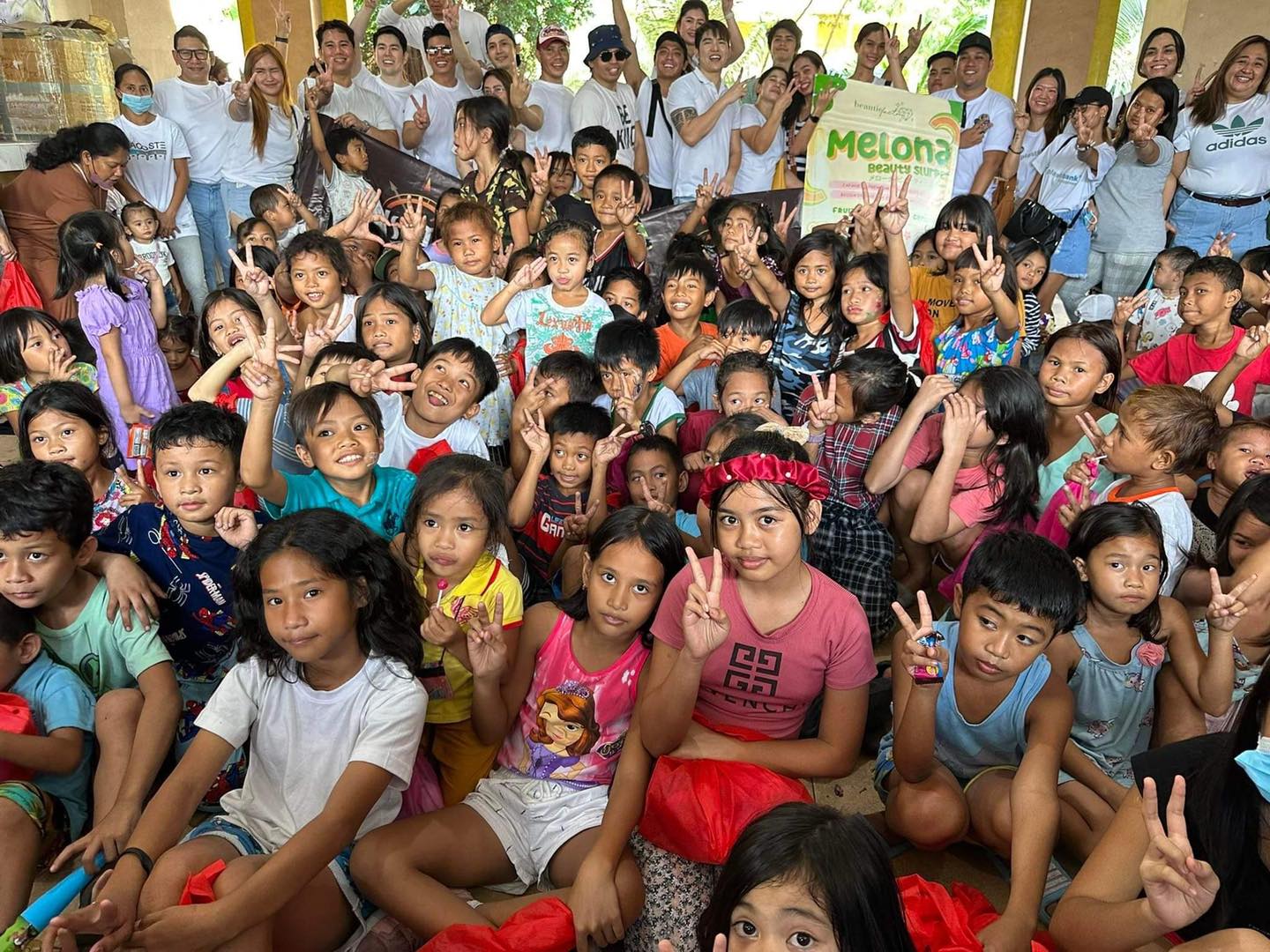 The Radiantz team and volunteers with children during a community outreach