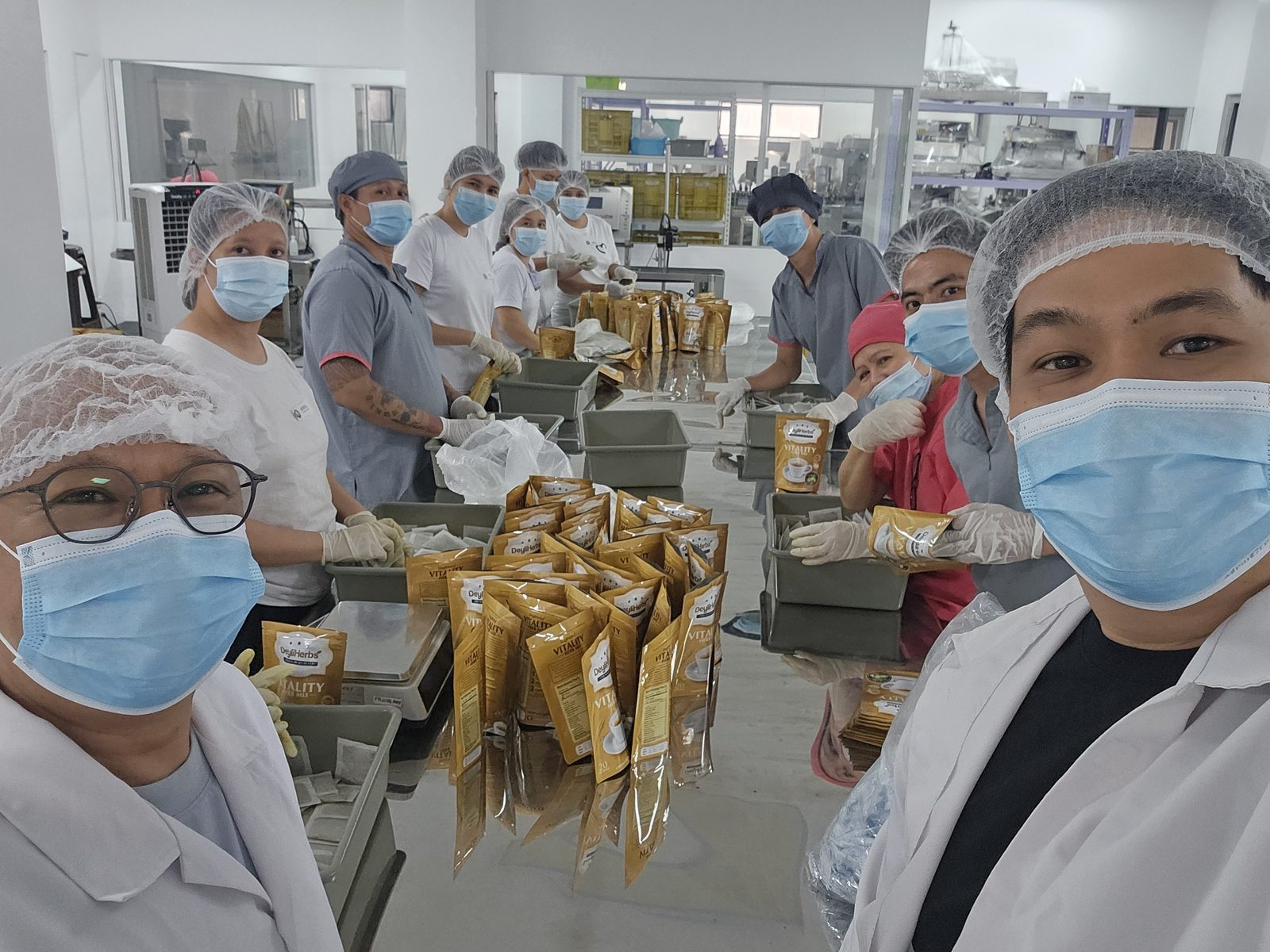 The Radiantz production team packing wellness coffee sachets